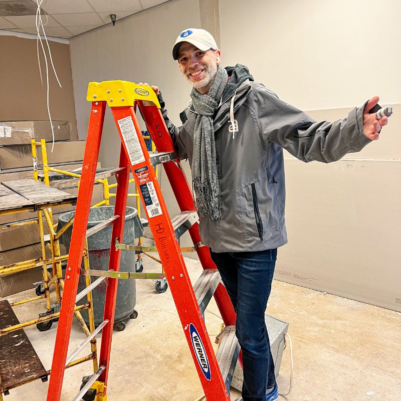 Rich Akullian on a ladder during the move into Studio A