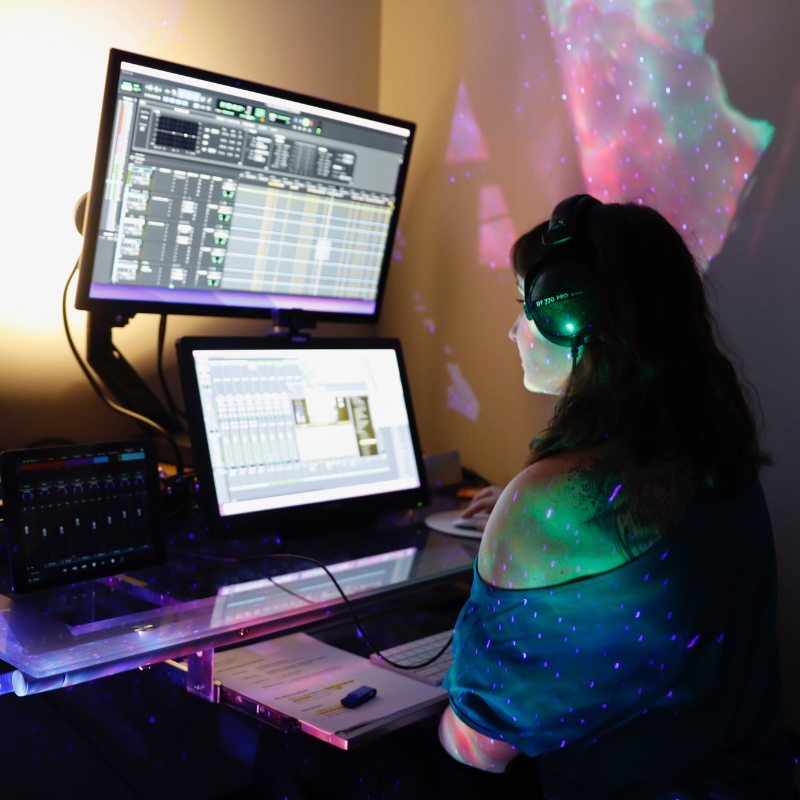 Our Audio Engineer Julia Norelli recording audio in Studio V
